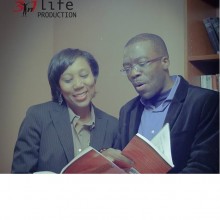 Andrea Holmes-Thompkins & Azuka reading “The Power to Excel” book together