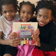 Kids happily display “A to Z of Success for Children” by Azuka Zuke, a book on amazon, xlibris, barnes&noble, bookstores.